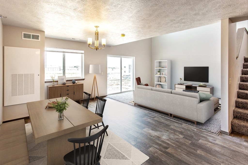 a living room and dining room with a couch and a table