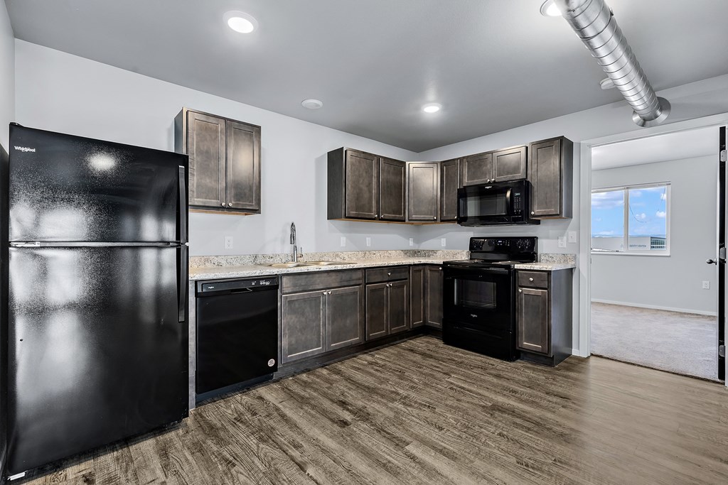 open kitchen with black appliances