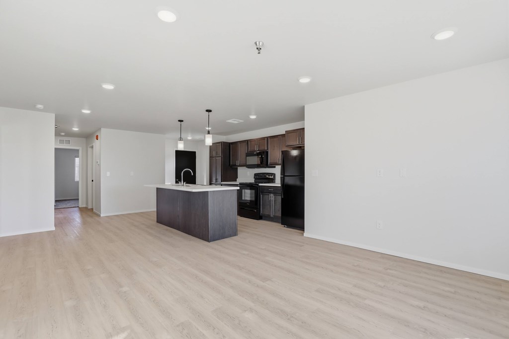 A kitchen area with a sink and a counter.