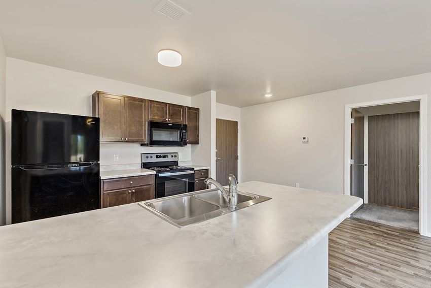 a kitchen with a large counter top and a sink