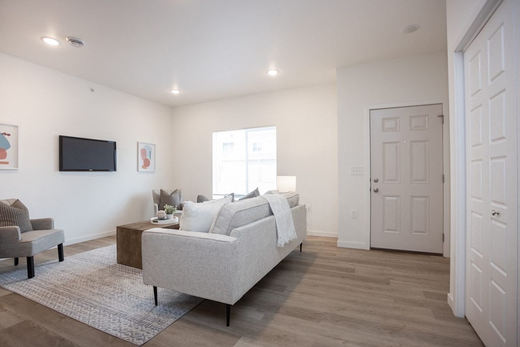 a living room with a couch and a tv