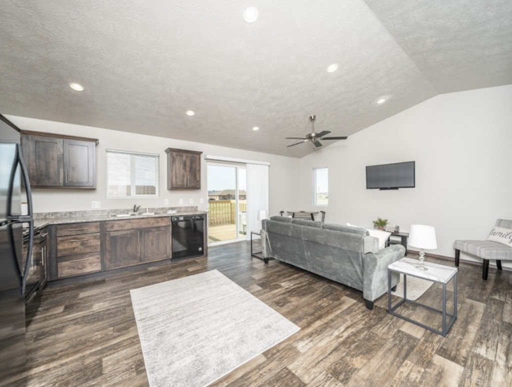 the living room is open to the kitchen and family room