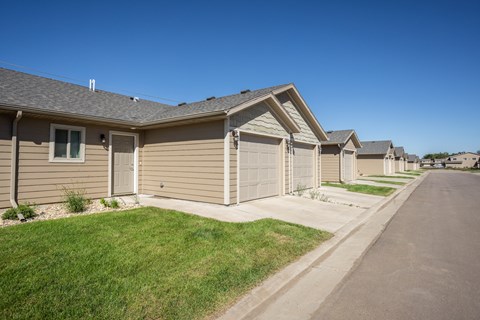 a row of houses on the side of a street