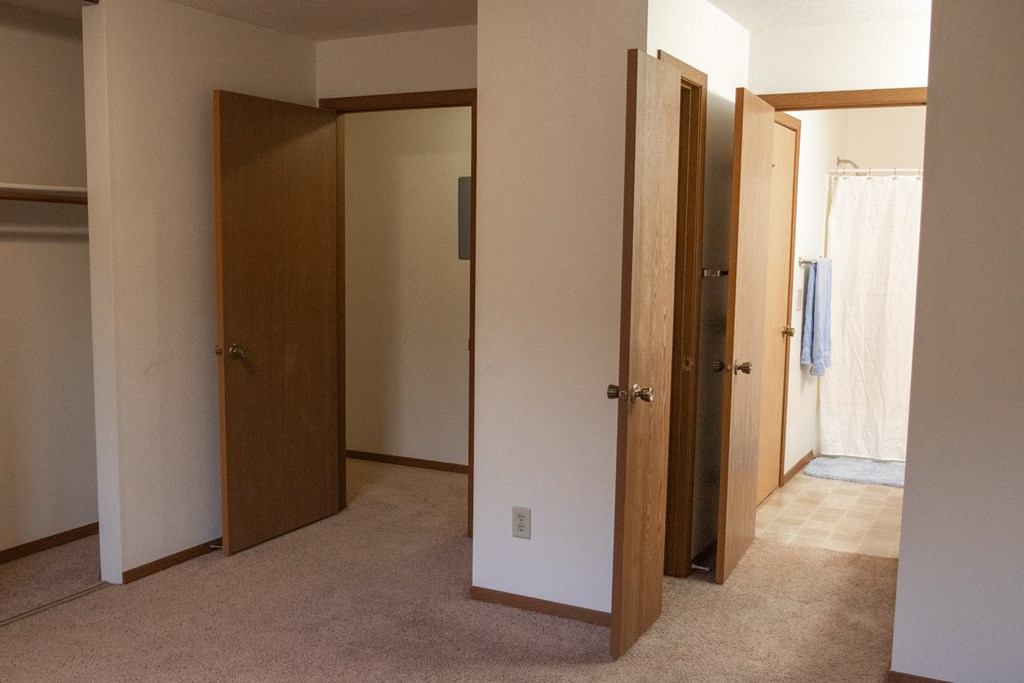 the master bedroom has three closets and two closet doors