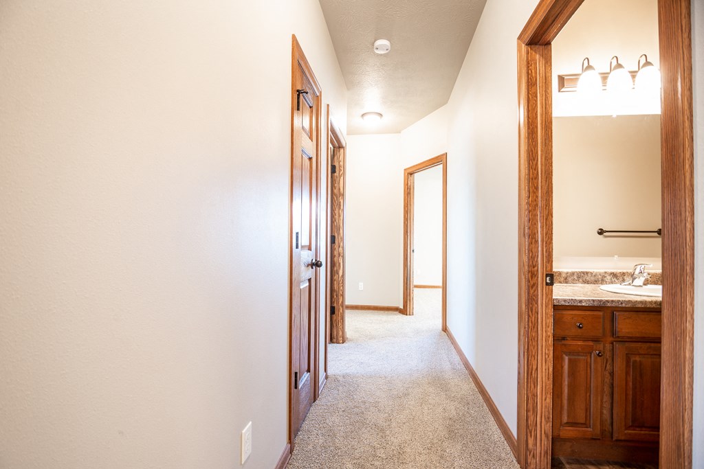 a bathroom with a sink and a mirror in a house