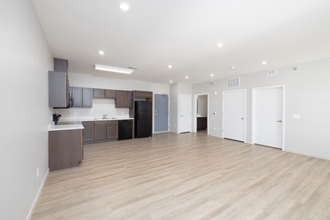 A kitchen area with a counter and cabinets.