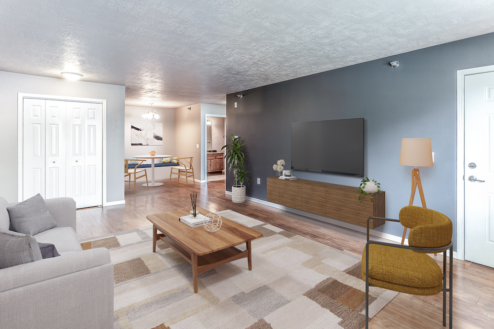 a living room with a couch and a coffee table and a television