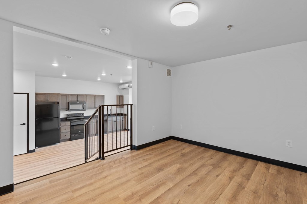 A room with wooden floors and white walls.