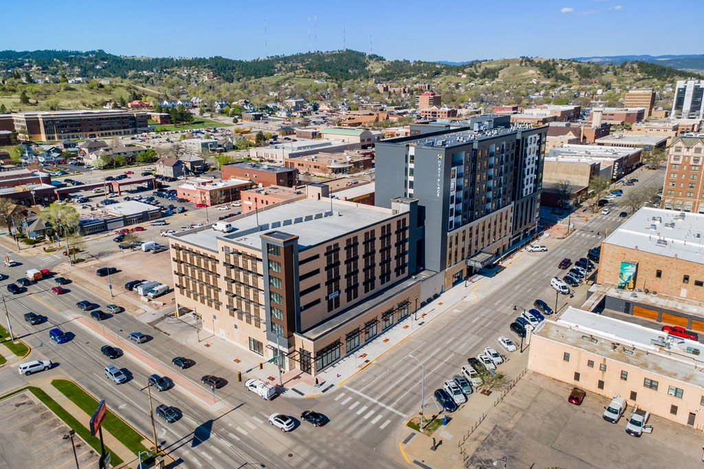 A city street with cars and buildings.