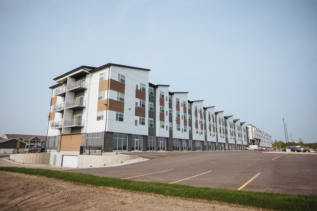 a building with a parking lot in front of it