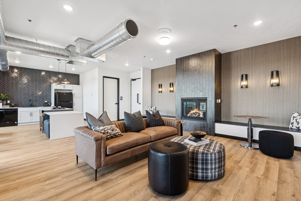 A modern living room with a fireplace and a couch.