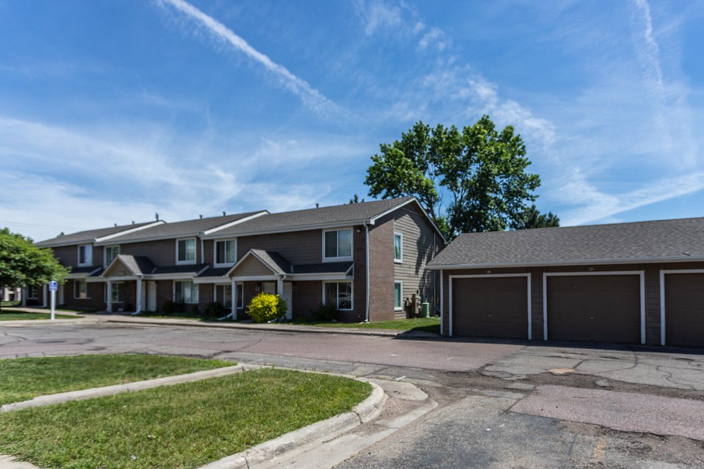 a house with a driveway and a street in front of it