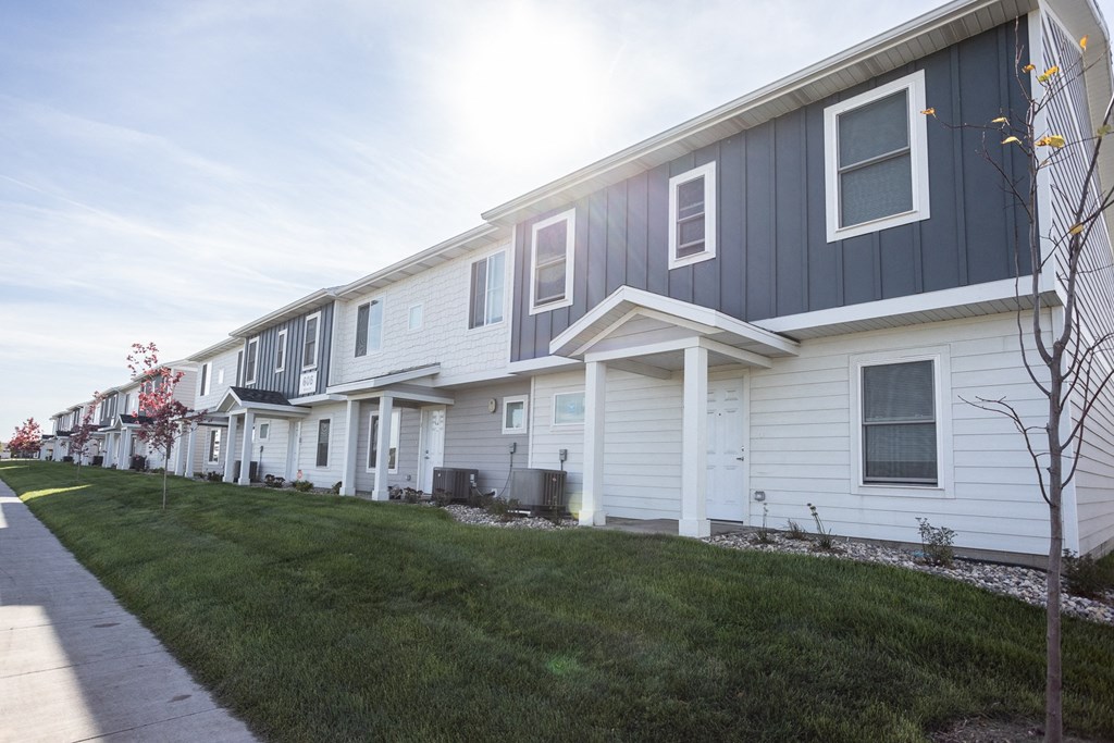 a row of houses on the side of a street