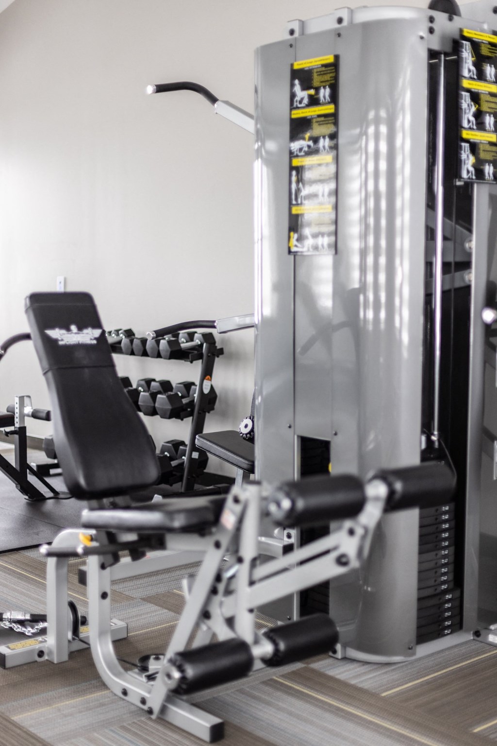 a row of weights machines in a gym