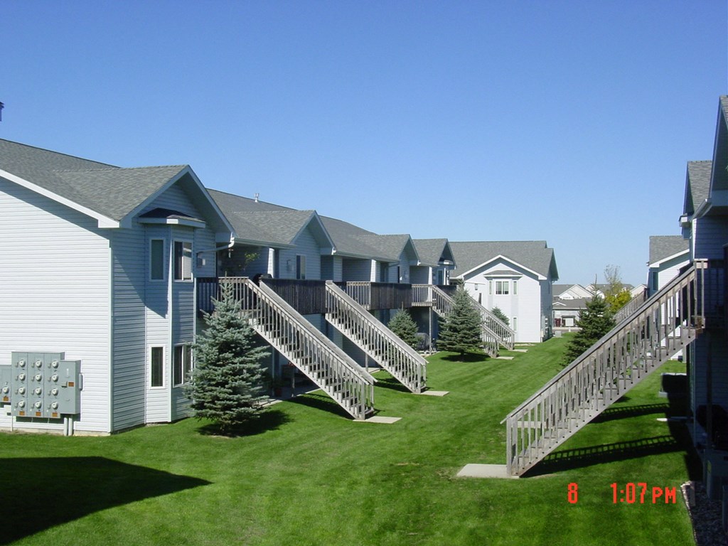 an image of a row of houses with decks