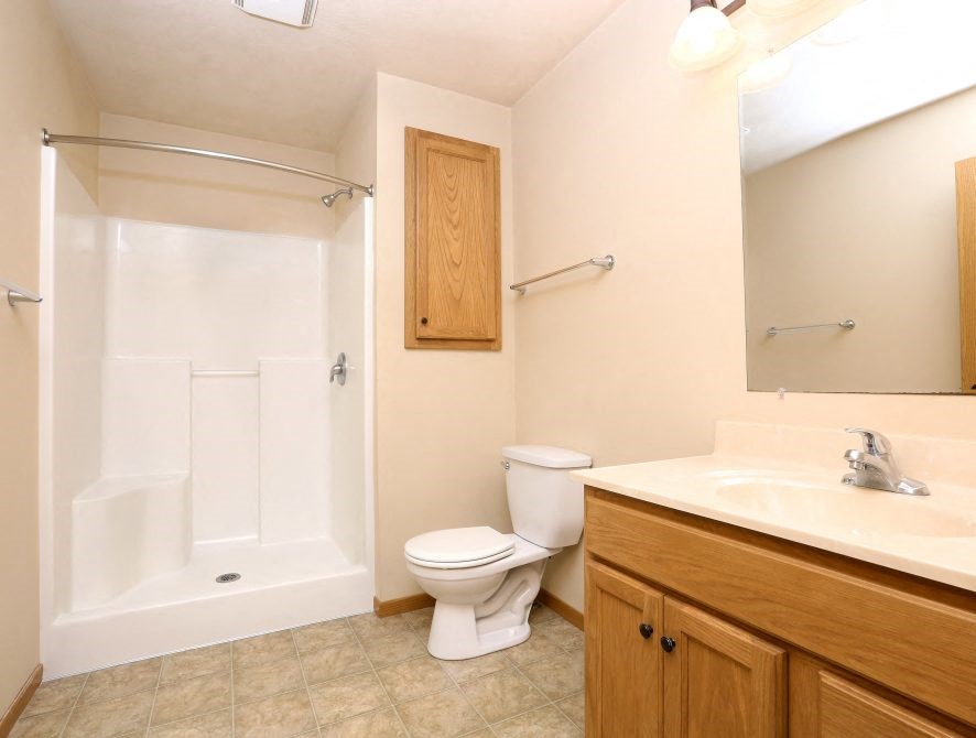 a bathroom with a sink toilet and a shower