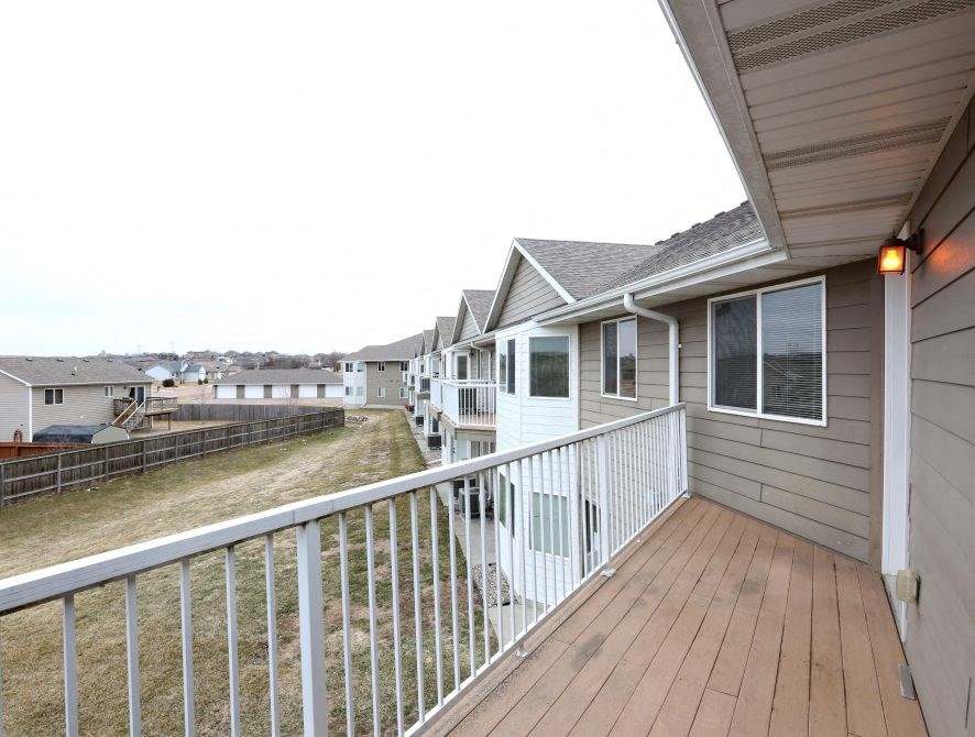 the view of a row of houses from a balcony