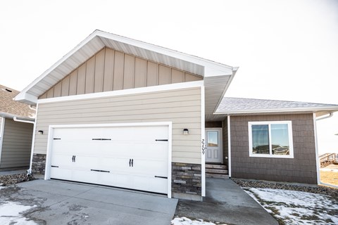 A two-car garage is attached to a house.