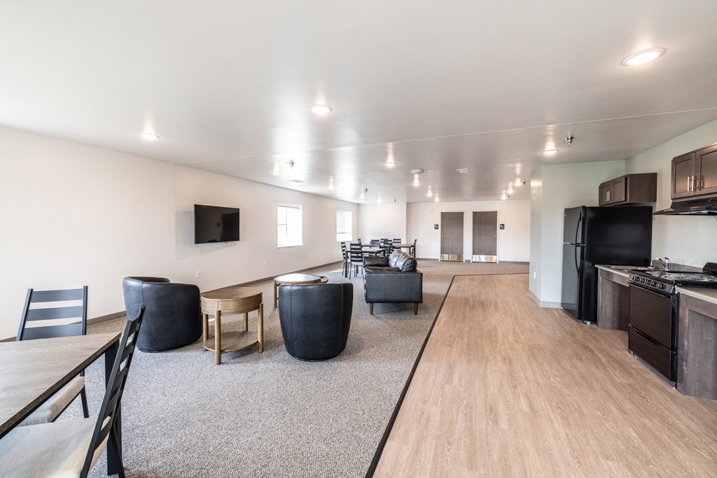 a large living room with a dining room and a kitchen