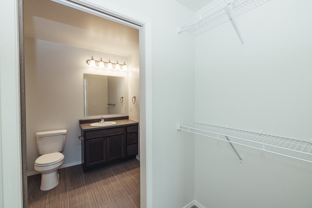 an empty bathroom with a toilet and a sink