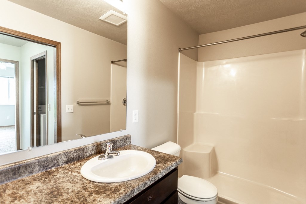 the preserve at ballantyne commons apartment bathroom with sink toilet and shower