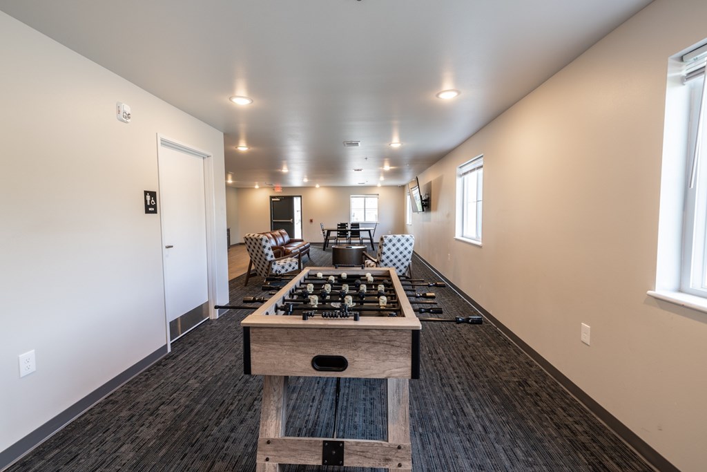 A kitchen with a wooden island in the middle of the room.