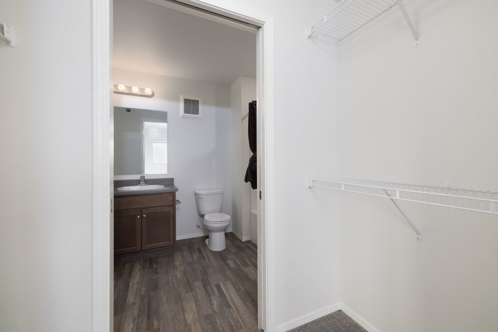 A bathroom with a toilet and sink is shown.