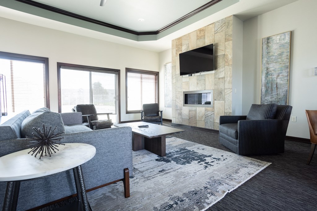 a living room with a couch and a table and a television
