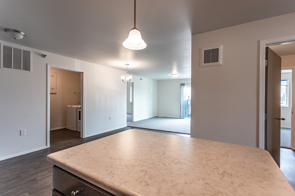 an empty kitchen and living room in a new home