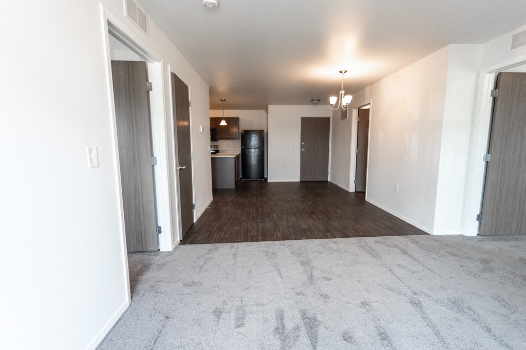 an empty living room and kitchen in a new apartment