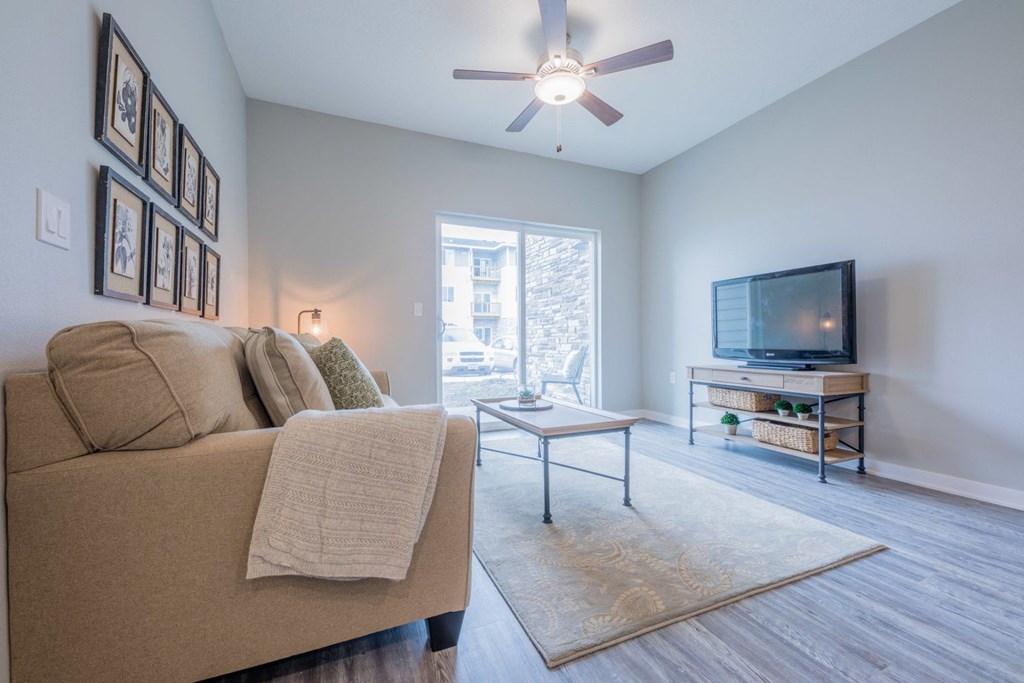 a living room with a couch and a tv
