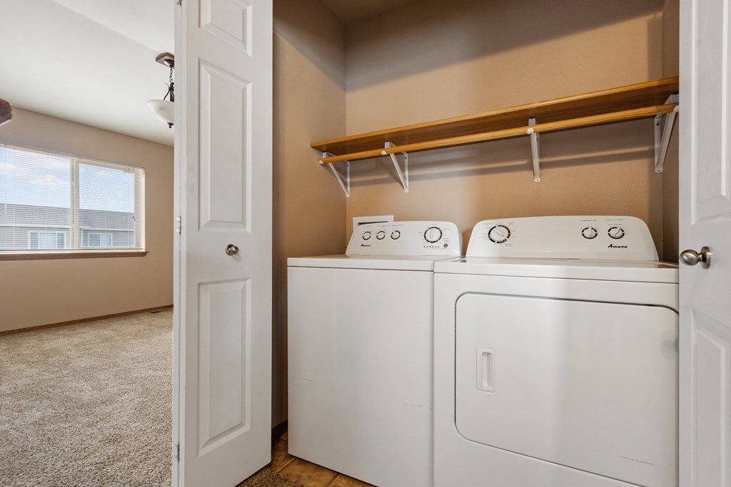 A laundry room with a washer and dryer.