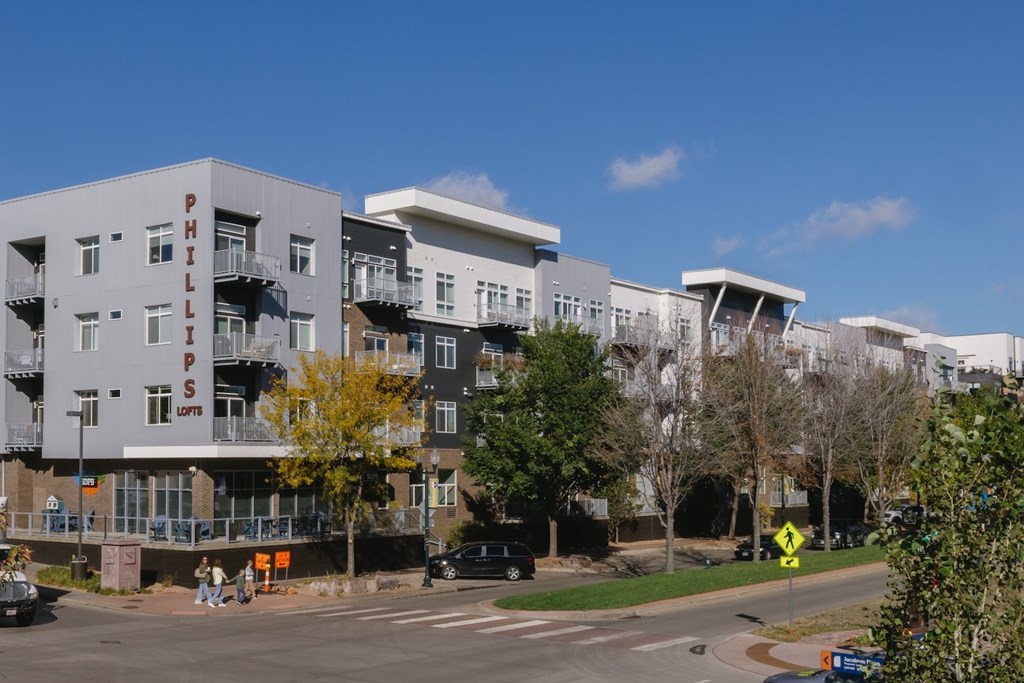 A Phillips apartment building with a clear blue sky in the background.