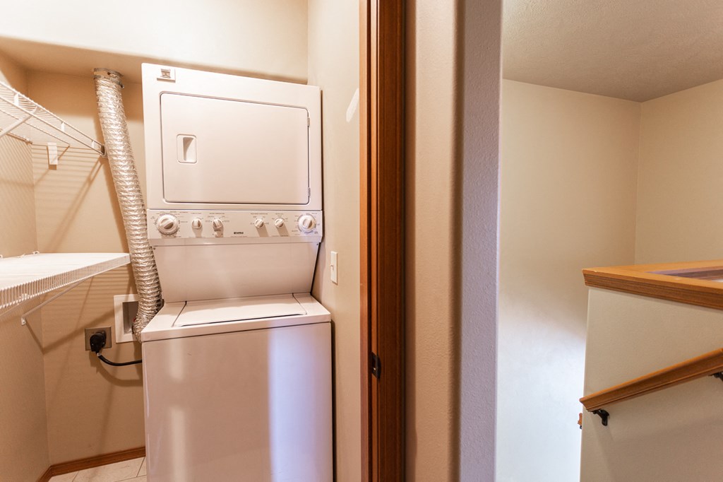 a washer and dryer in a small laundry room