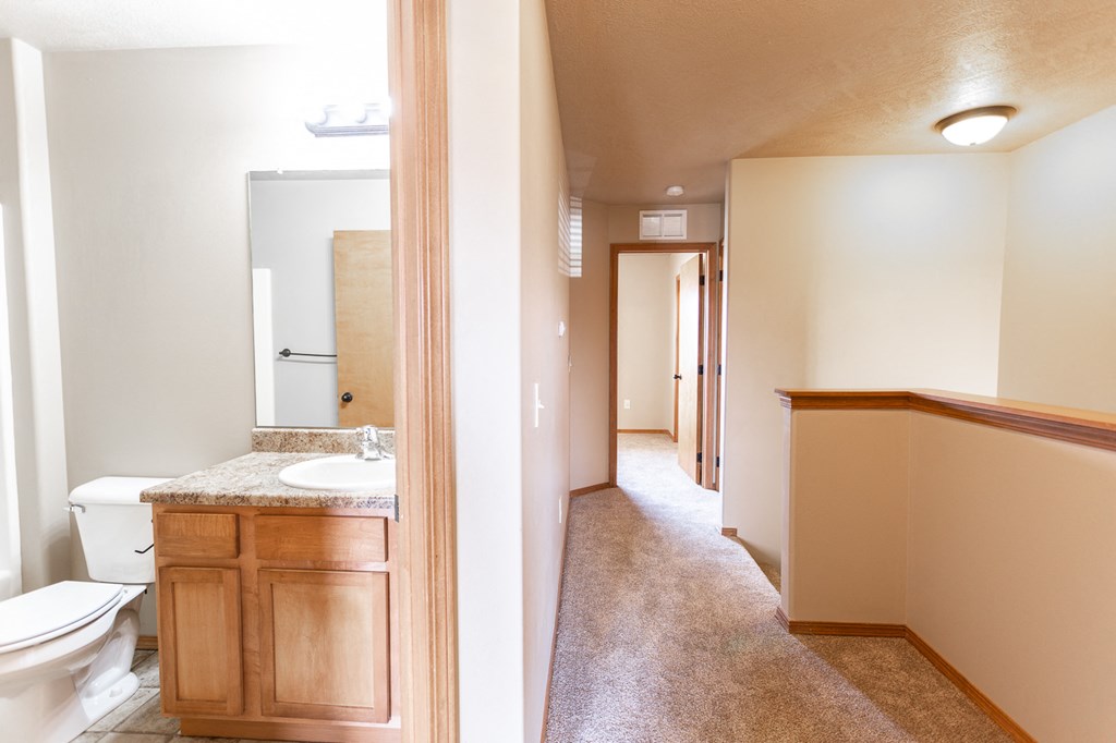 a full view of a bathroom with a toilet and a sink
