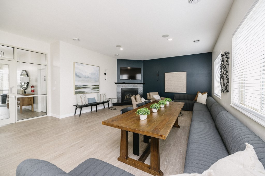 a living room with a couch and a wooden table