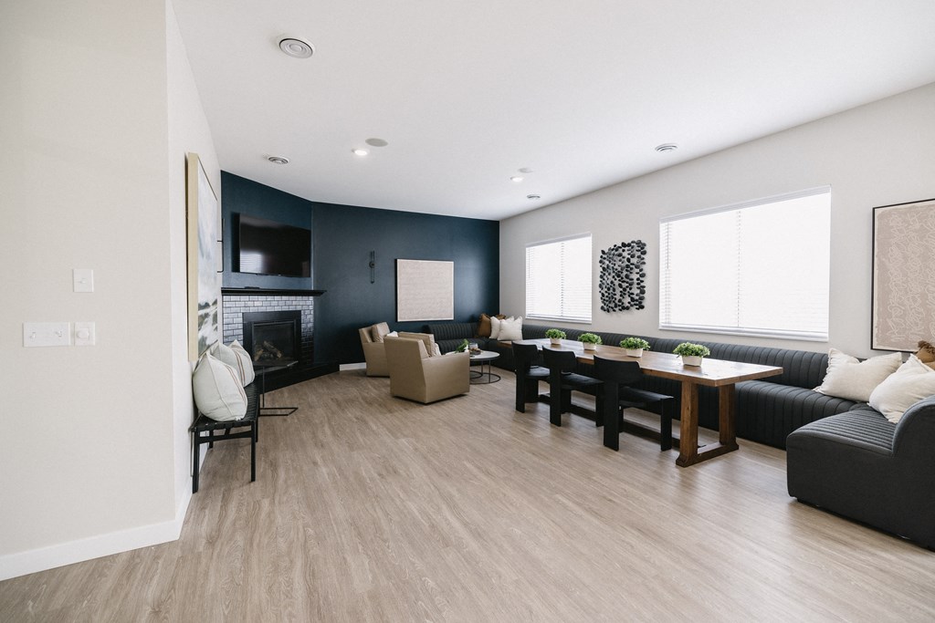 a living room with a couch and a table and a fireplace