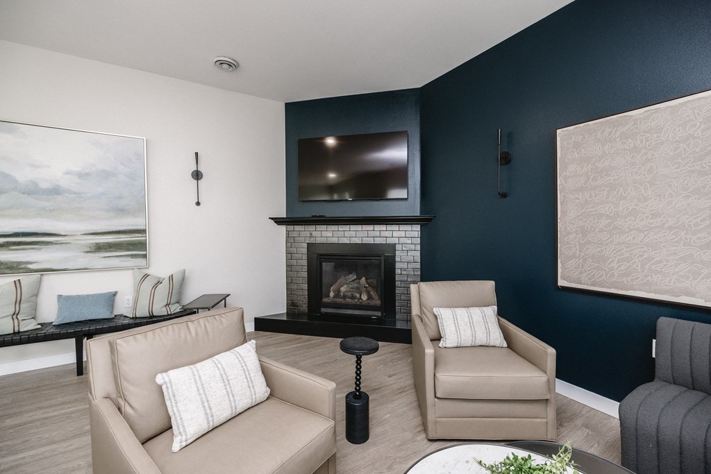 a living room with a fireplace and a television