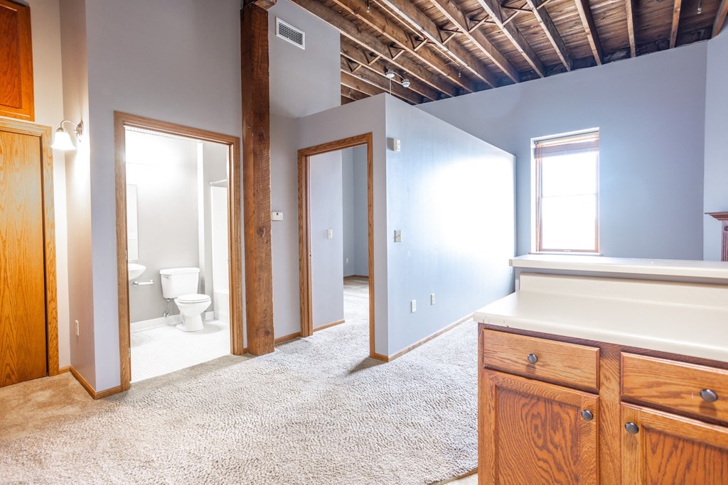 a bathroom with a sink and a toilet in a room with blue walls