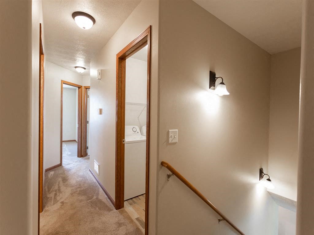 the upstairs passage to the bathroom and the hall to the bedroom and the laundry room