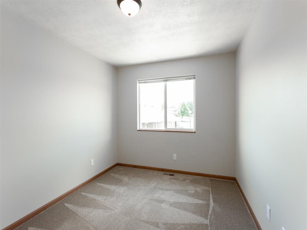 an empty room with a window in it