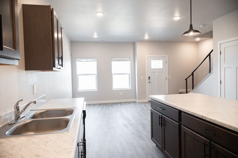 A kitchen with a sink and cabinets.