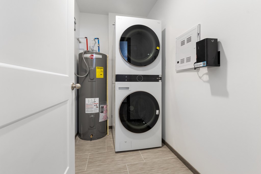 A washing machine and dryer in a small laundry room.