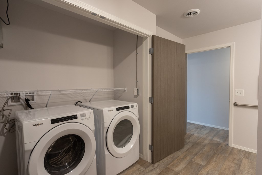 a washer and dryer in a laundry room with a door