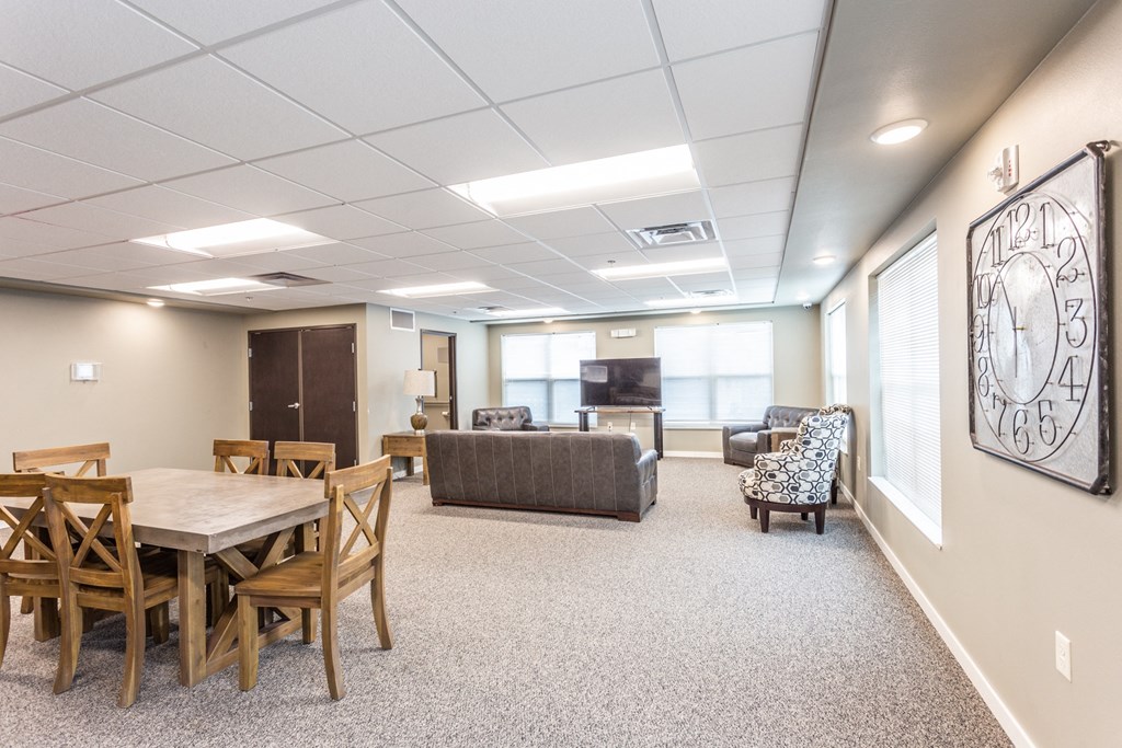 a large room with a table and chairs and a couch