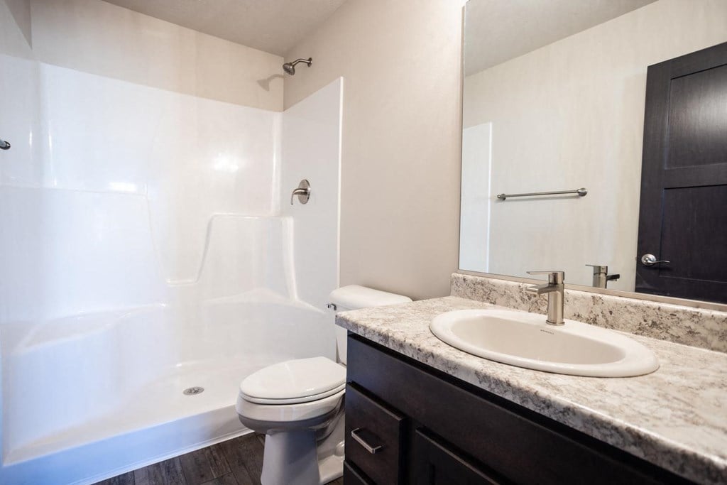 a bathroom with a sink toilet and a bath tub