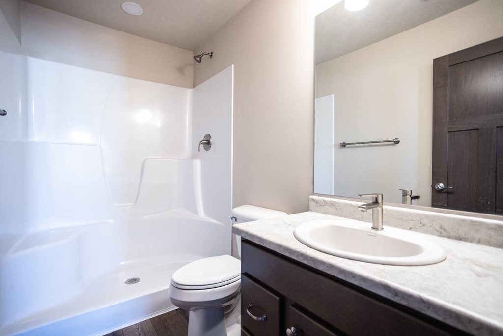 a bathroom with a sink toilet and a bath tub