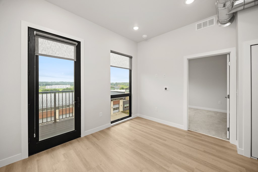 A room with a sliding door and a window.