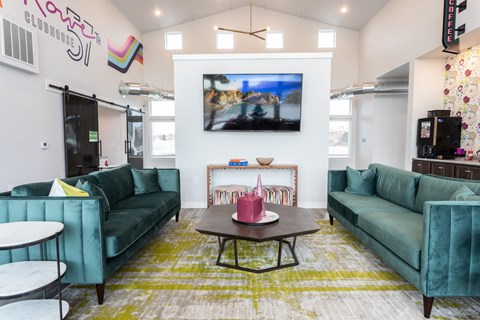 a living room with blue couches and a coffee table