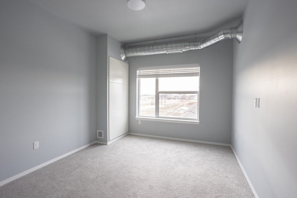 an empty room with a window in it